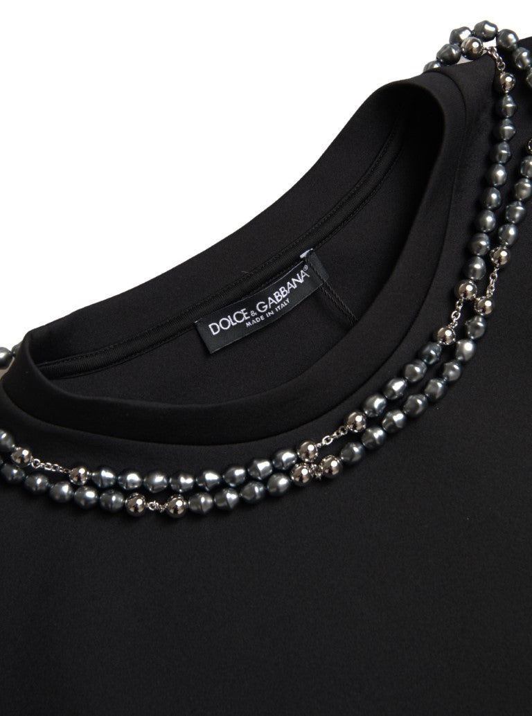 Black shirt with pearl necklace
