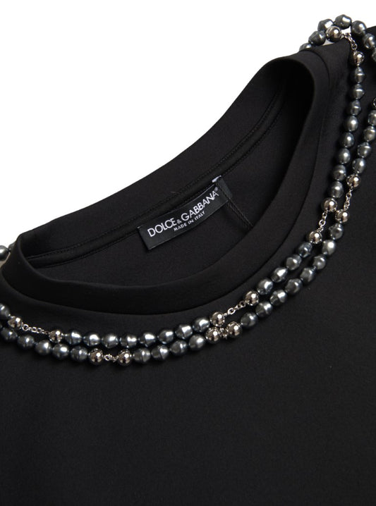 Black shirt with pearl necklace