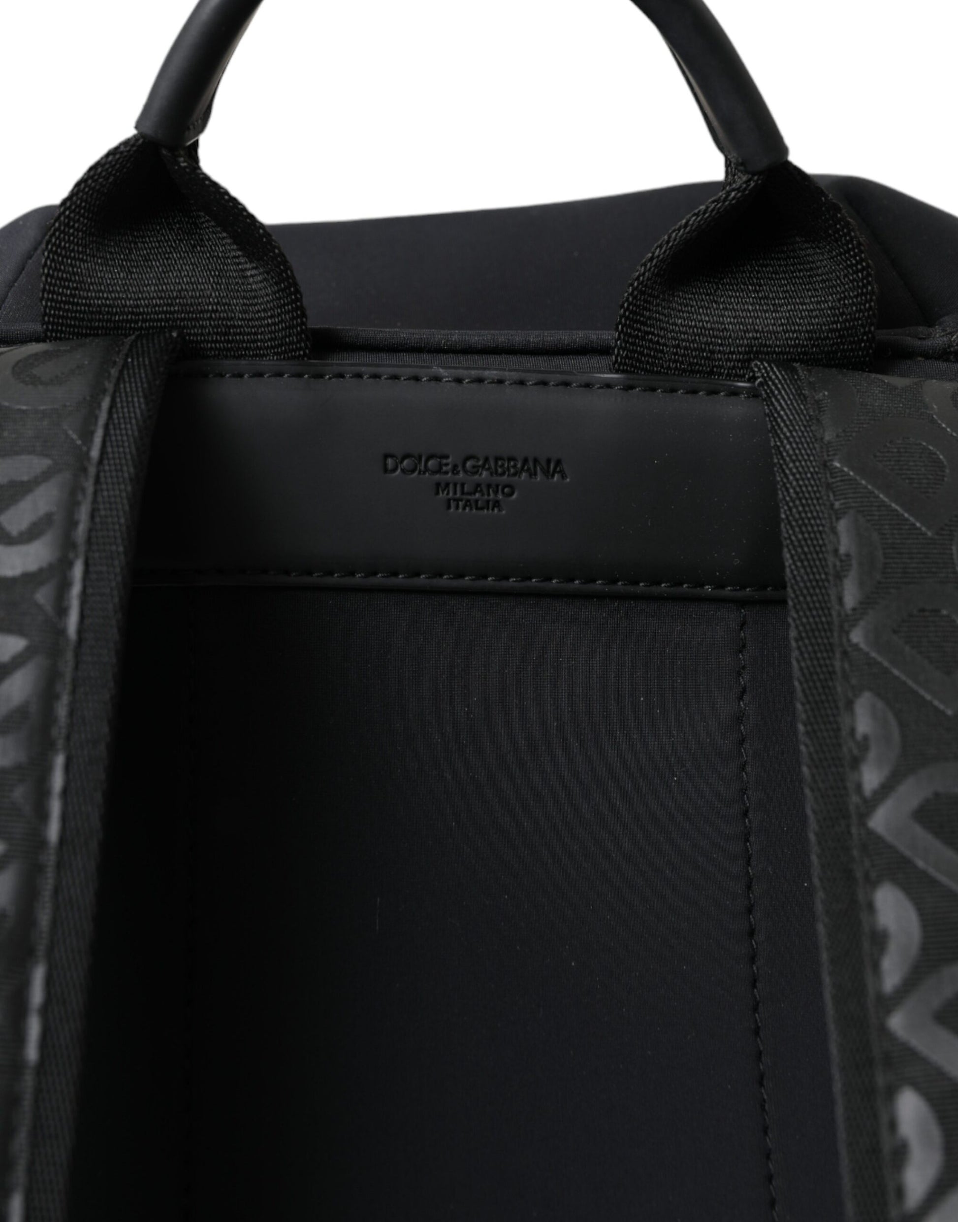 Black backpack with handle and zippered compartments