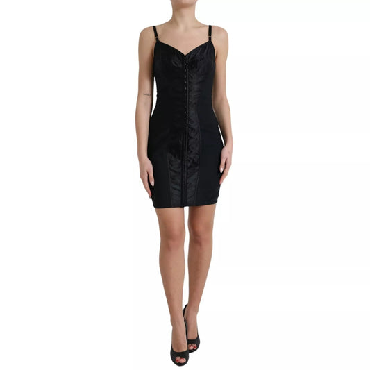 A black nylon bodycon corset bustier mini dress with a fitted silhouette