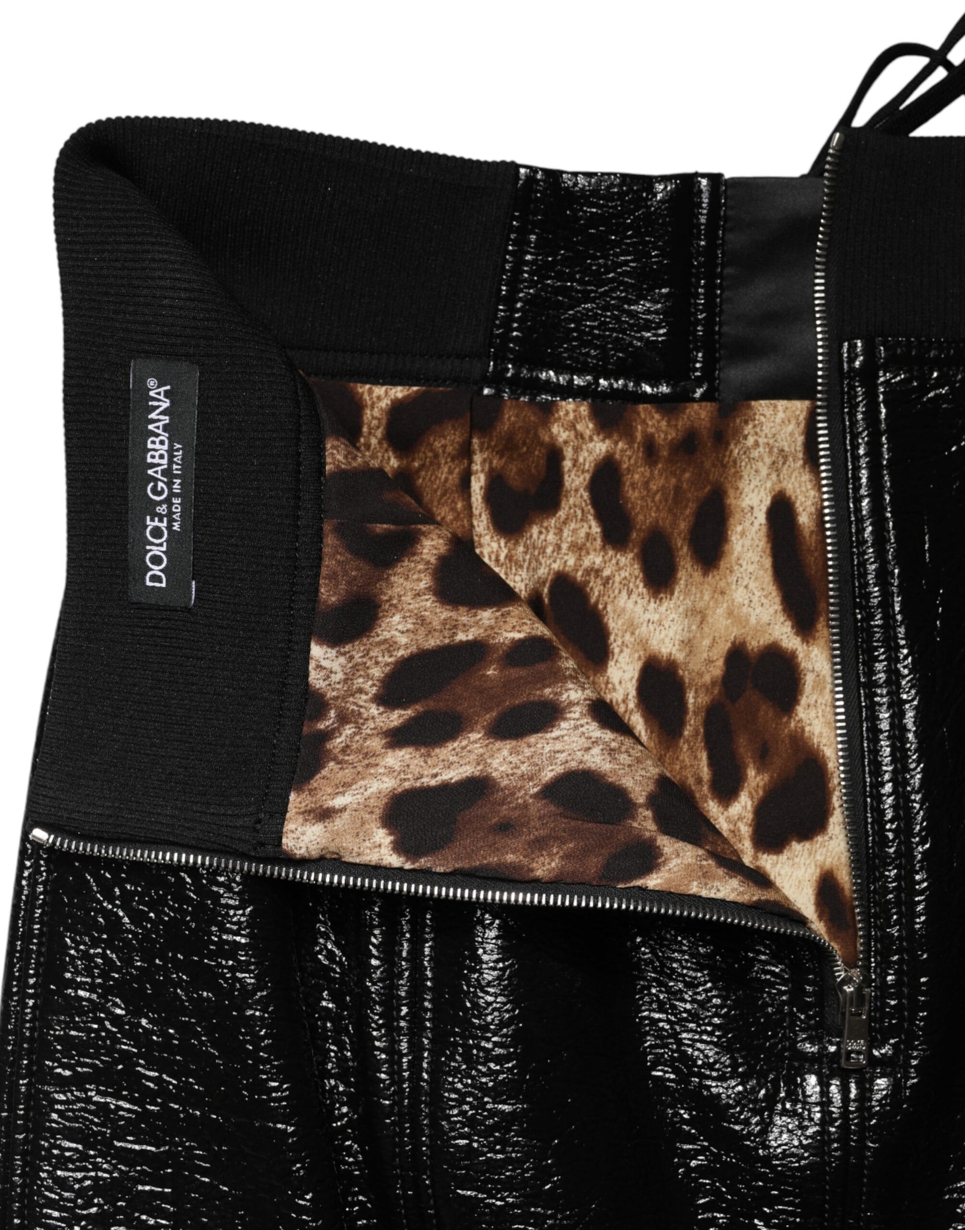 Black leather pants with zippered side pocket featuring a cheetah print