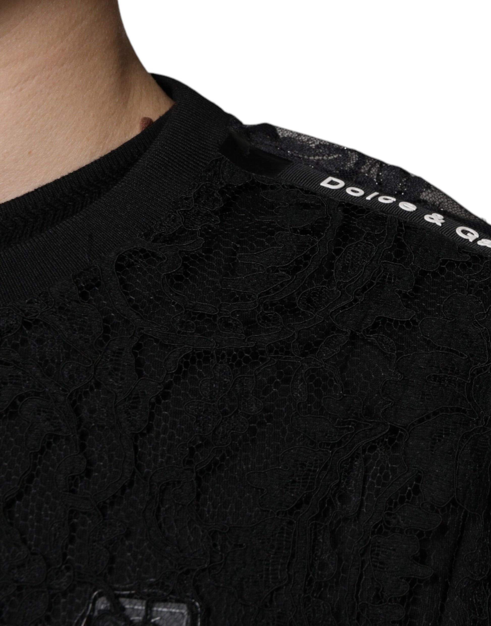 Black shirt with embroidered design on shoulder