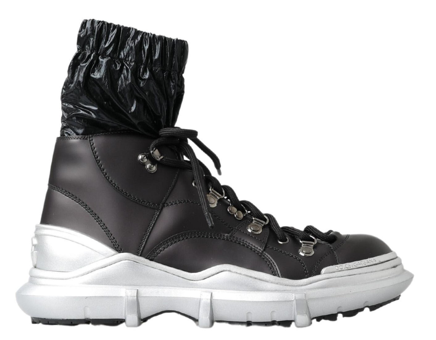 Pair of black and white boots with laces and buckles