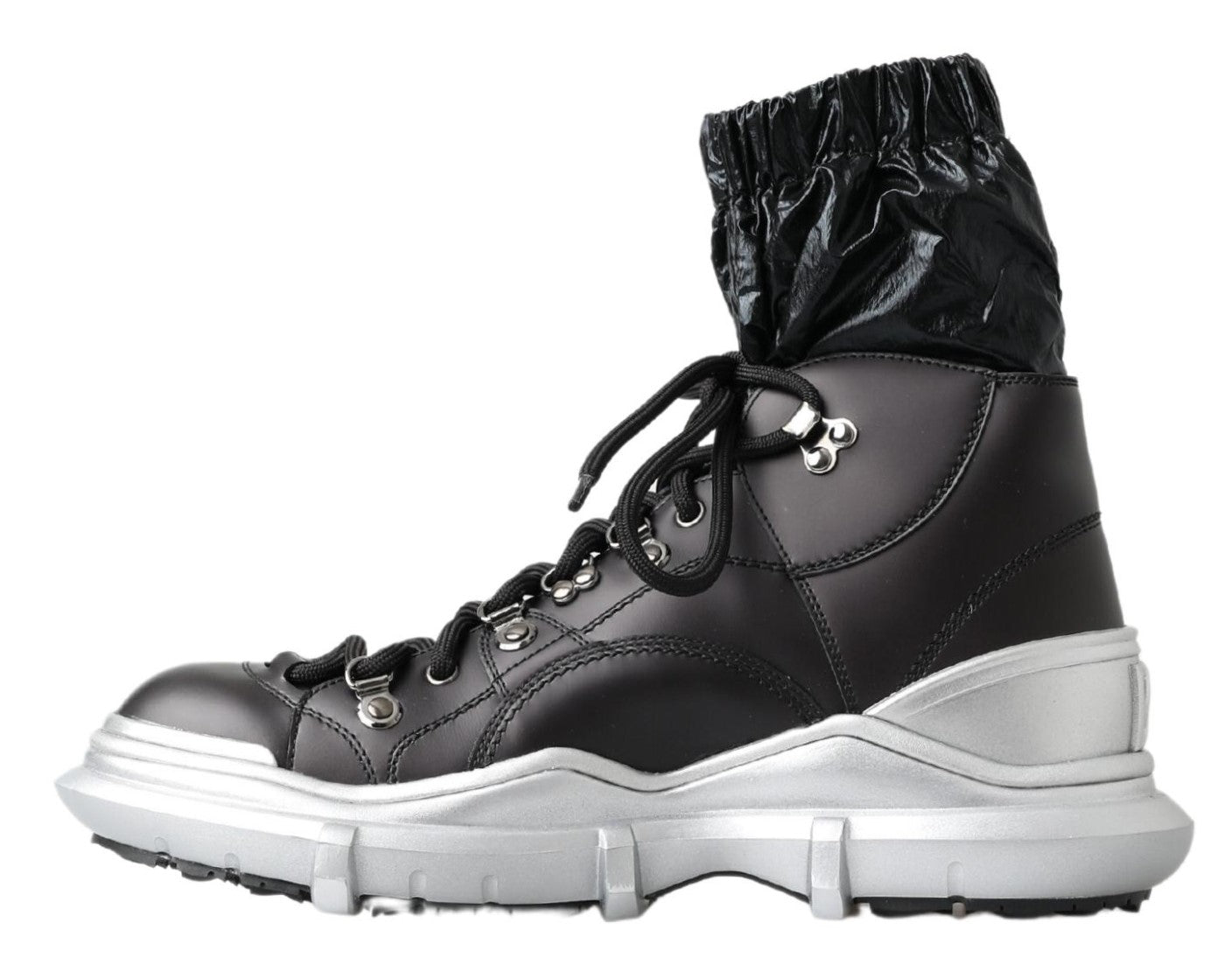 Pair of black and white boots with laces and a pull tab