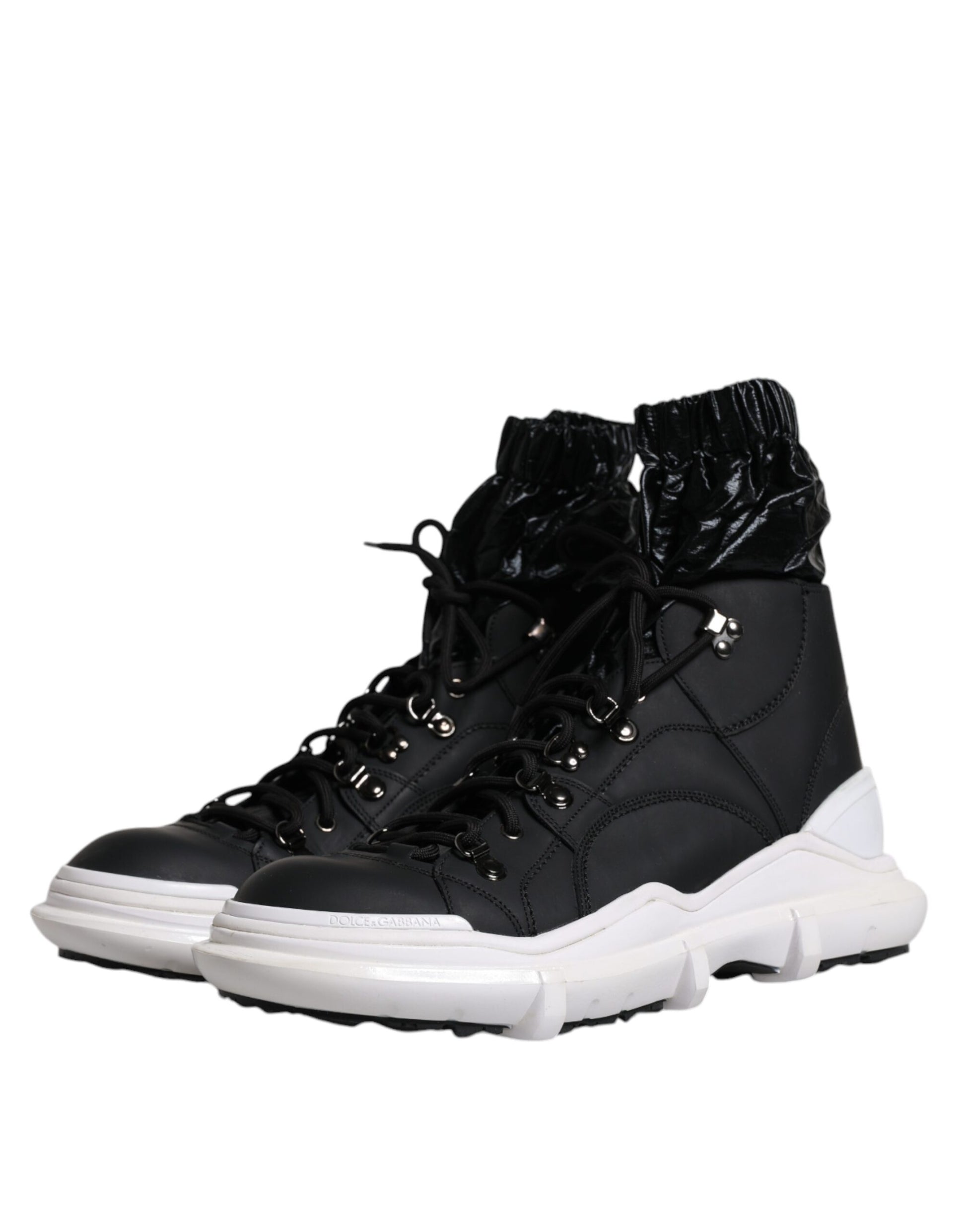 Black and white high top sneakers with laces and a black zipper on the side
