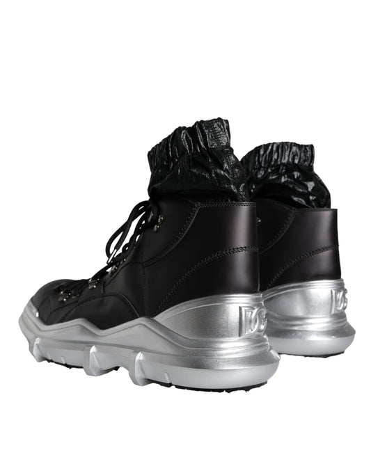 Pair of black and white sneakers with silver accents
