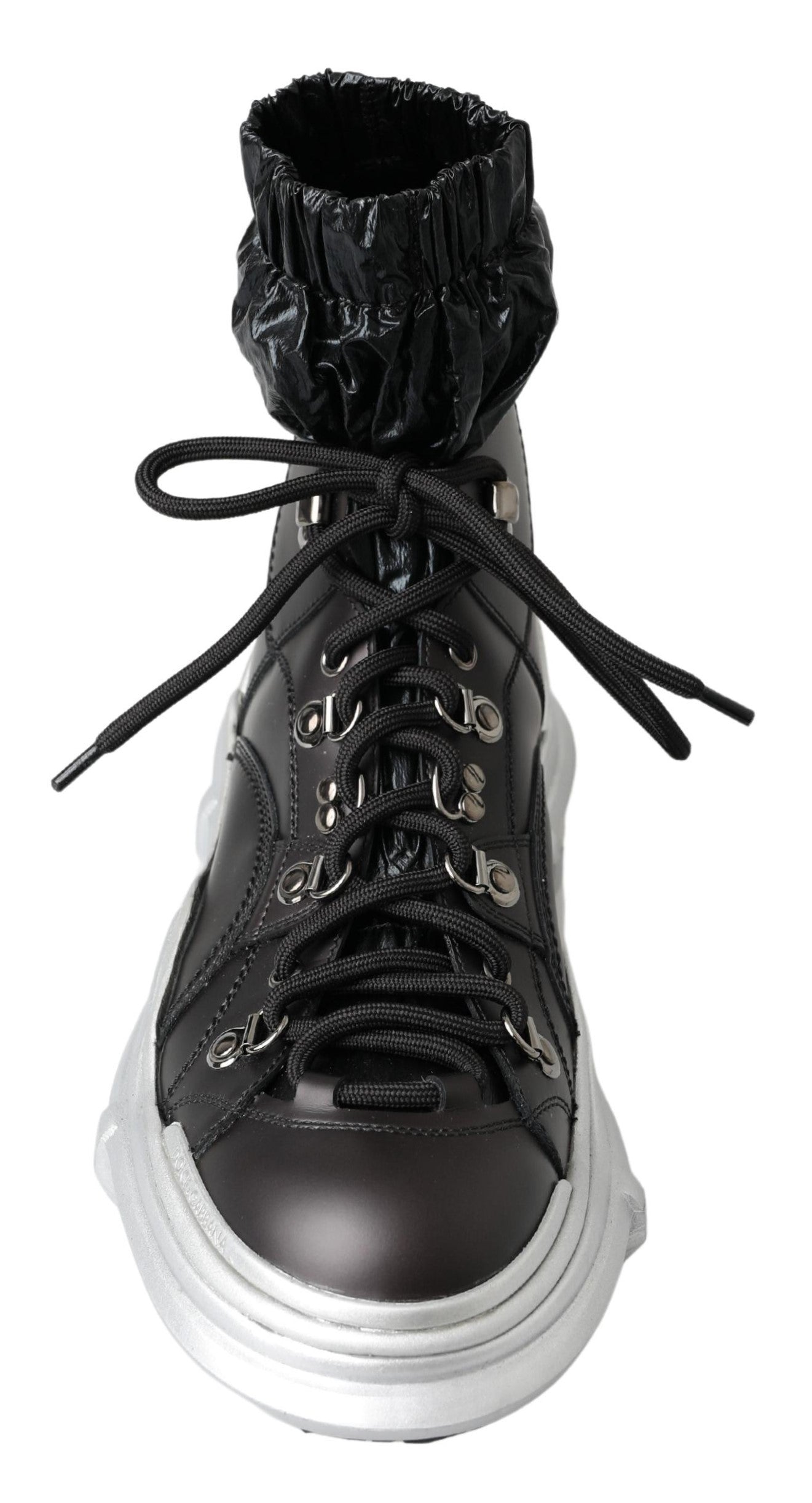 Black lace-up boot with silver buckles and a chunky sole