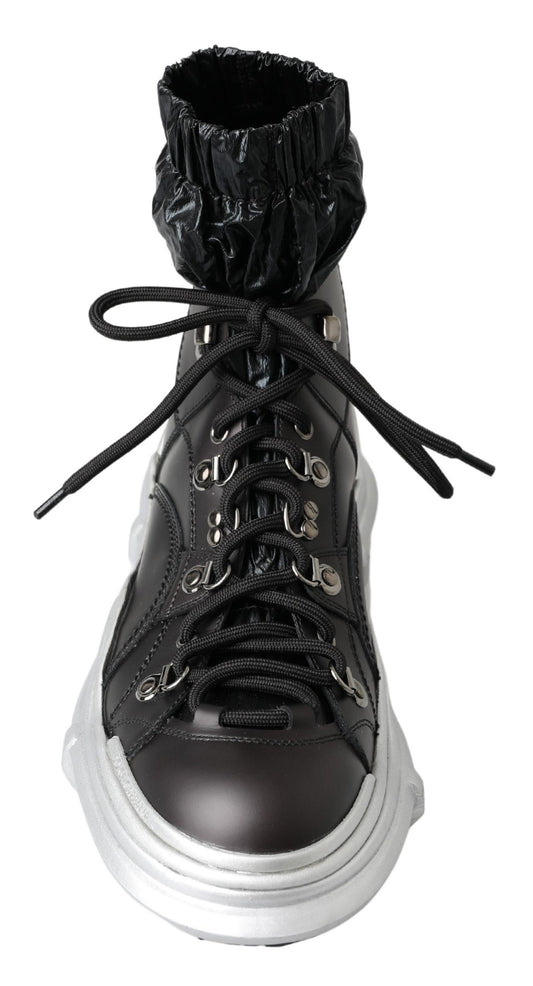 Black lace-up boot with silver buckles and a chunky sole