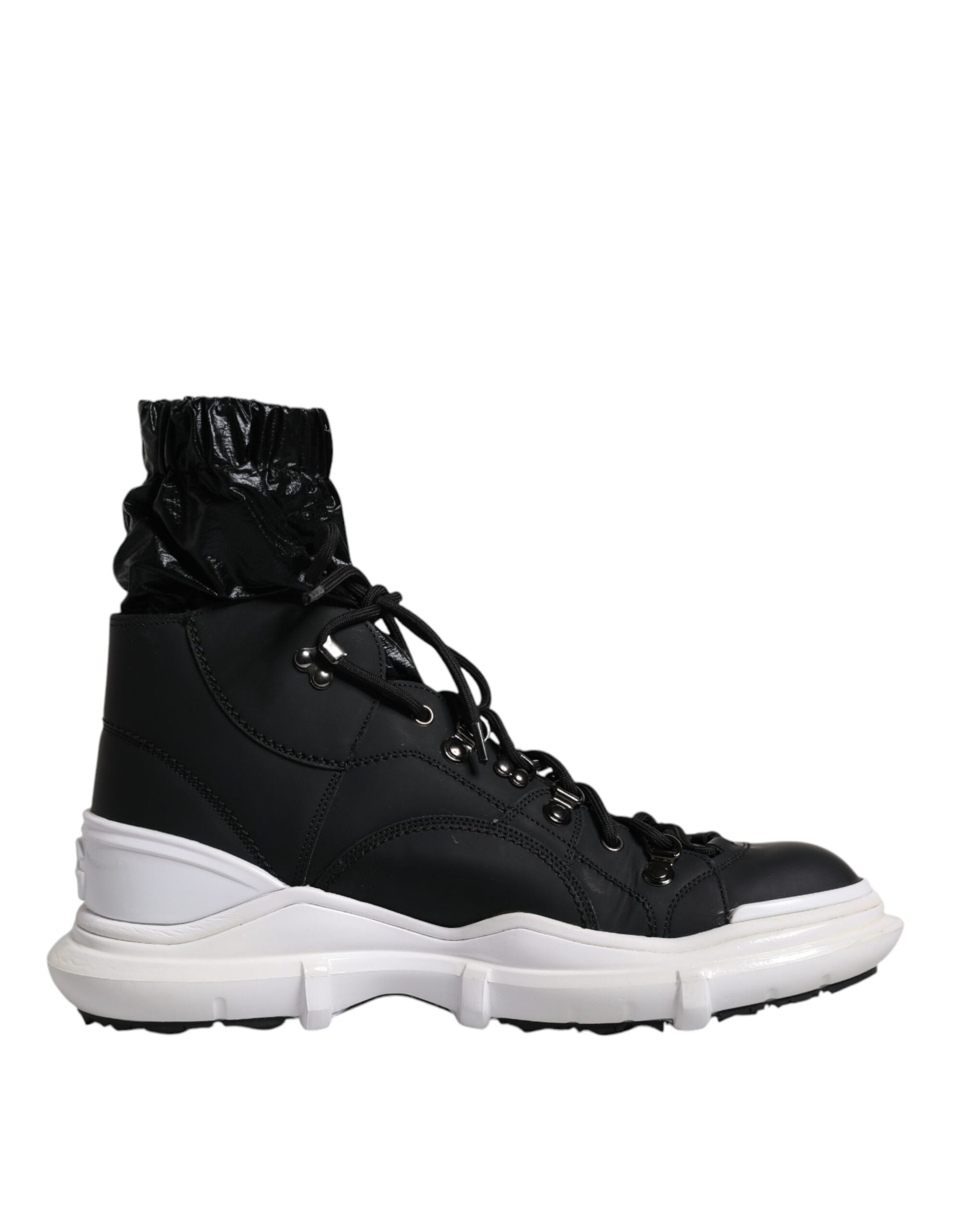 Black and white hiking boot with laces tied around ankle