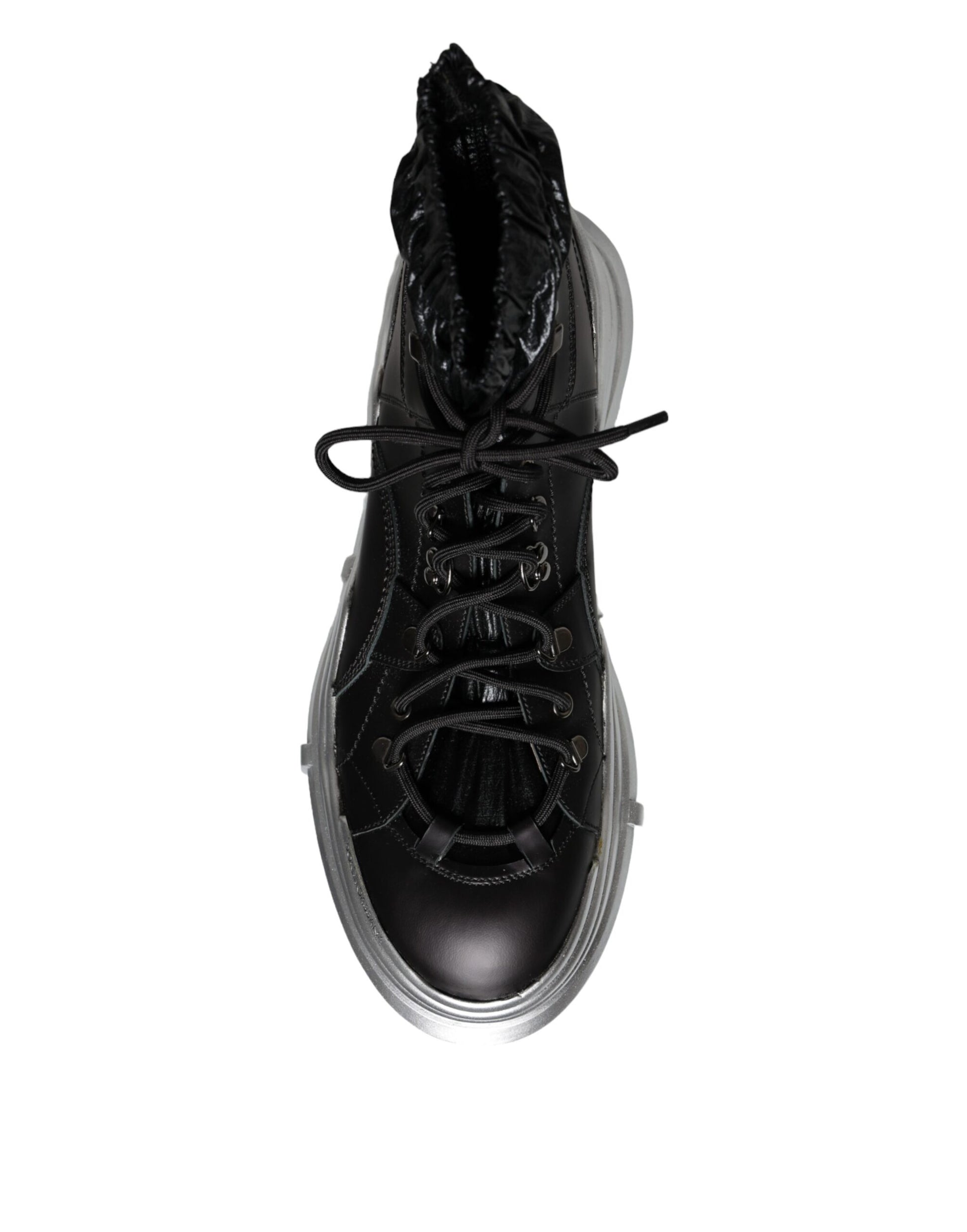 Black high top sneaker with white sole and laces