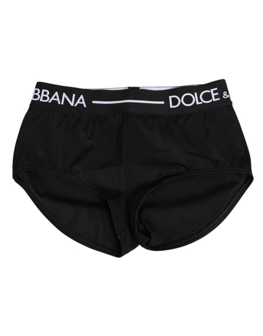 Black nylon waistband shorts with white logo text