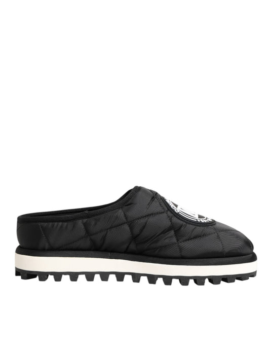 A pair of black nylon slip-on shoes with white soles