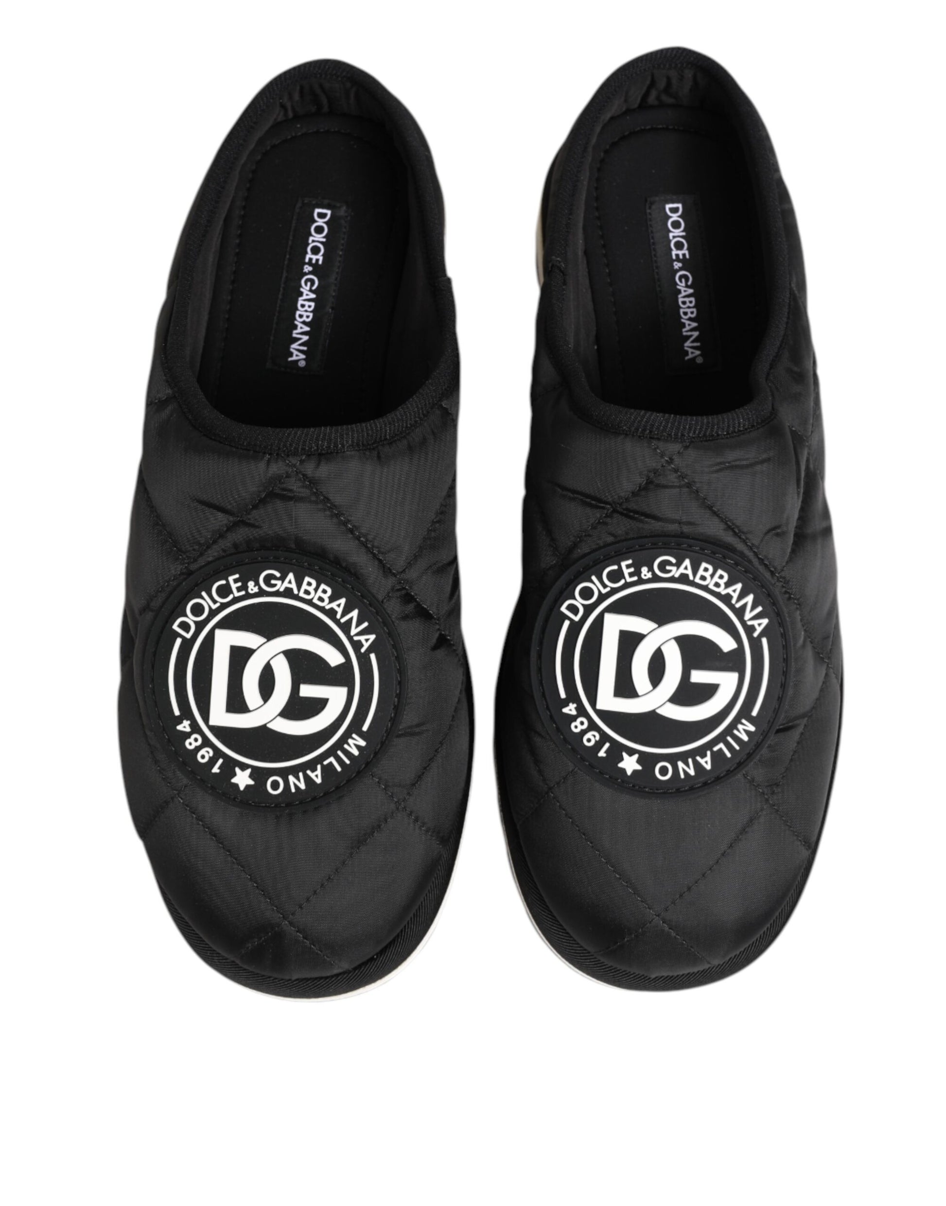 Pair of black nylon slip-on shoes with white logo on side