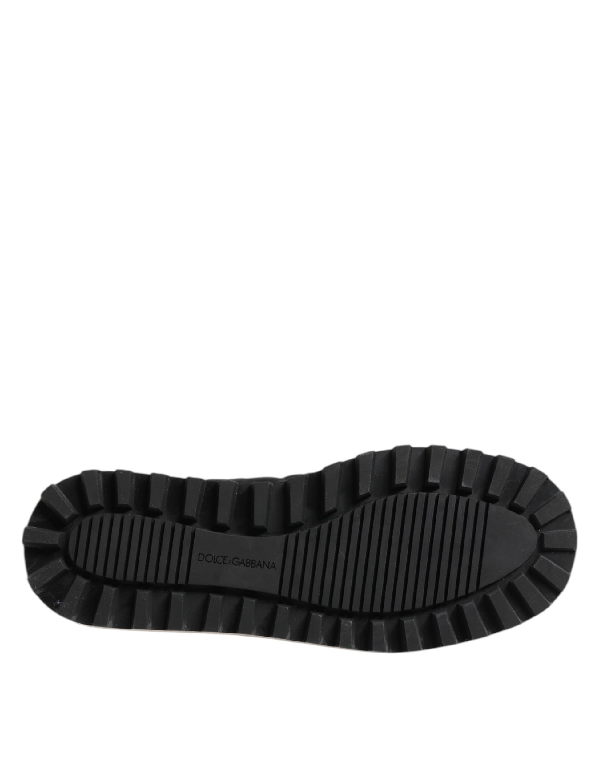 A single black nylon shoe with a low top and slip-on design