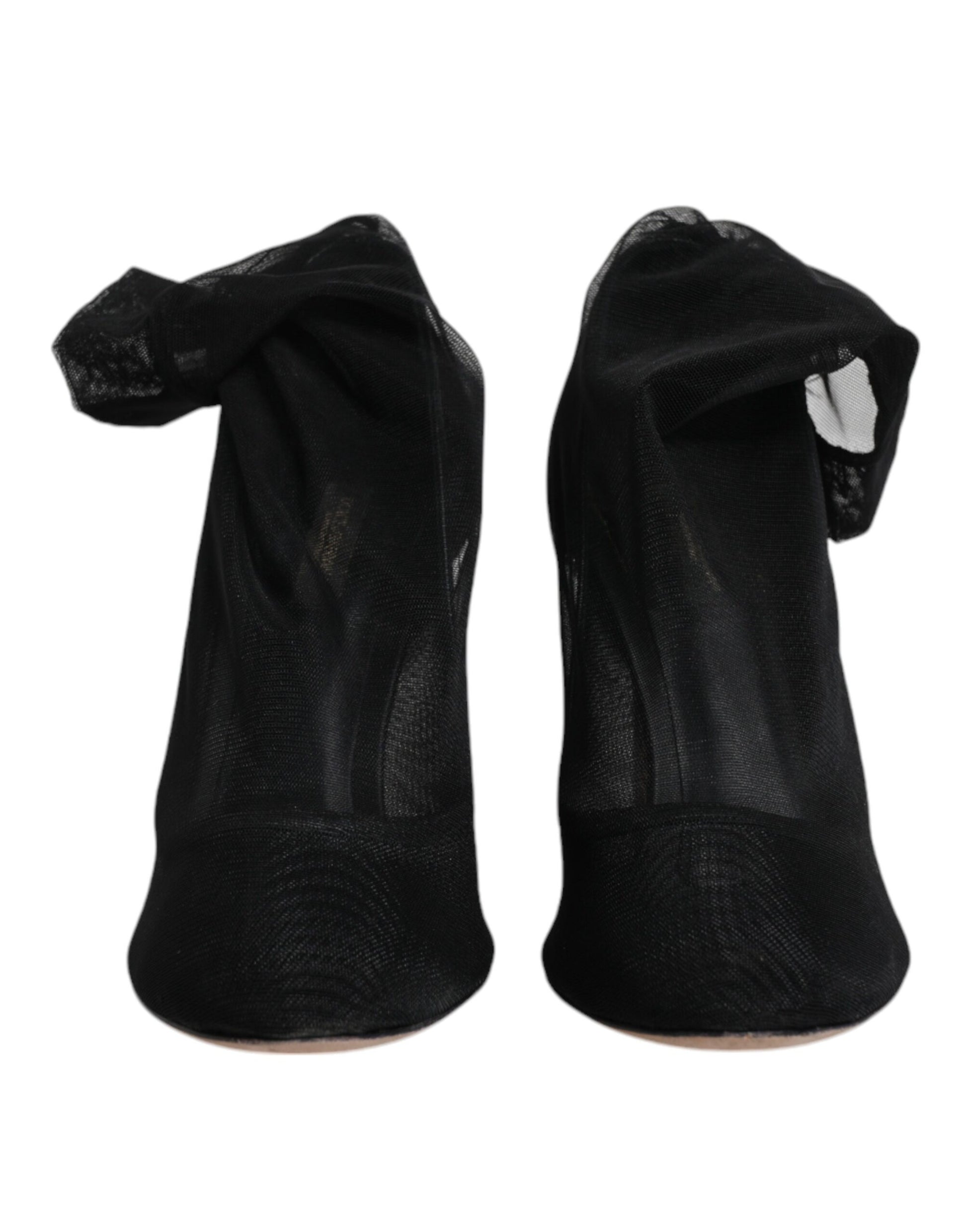 Pair of black sneakers in plastic bags