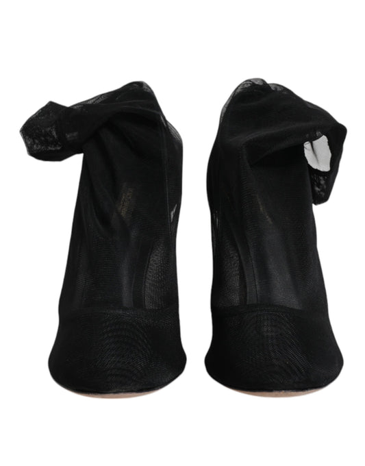 Pair of black sneakers in plastic bags