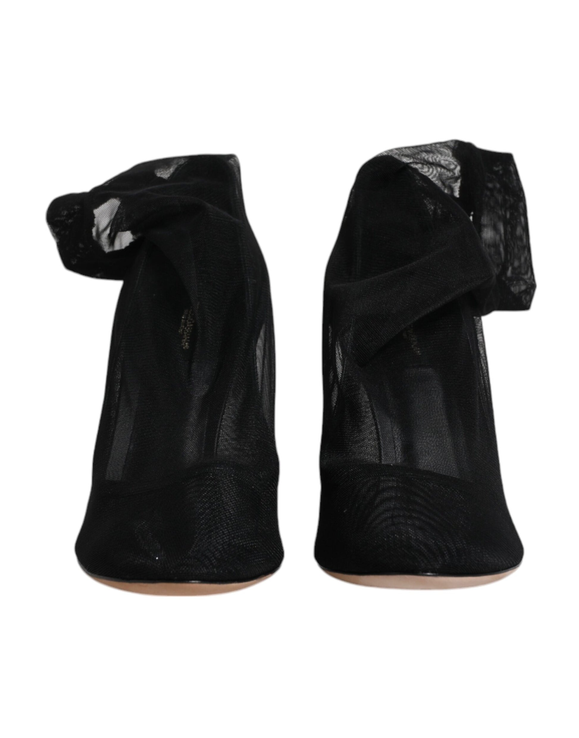 Pair of black high heel shoes with straps