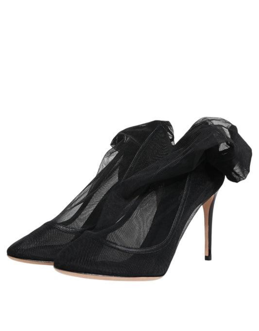 Pair of black high heel shoes with lace detailing