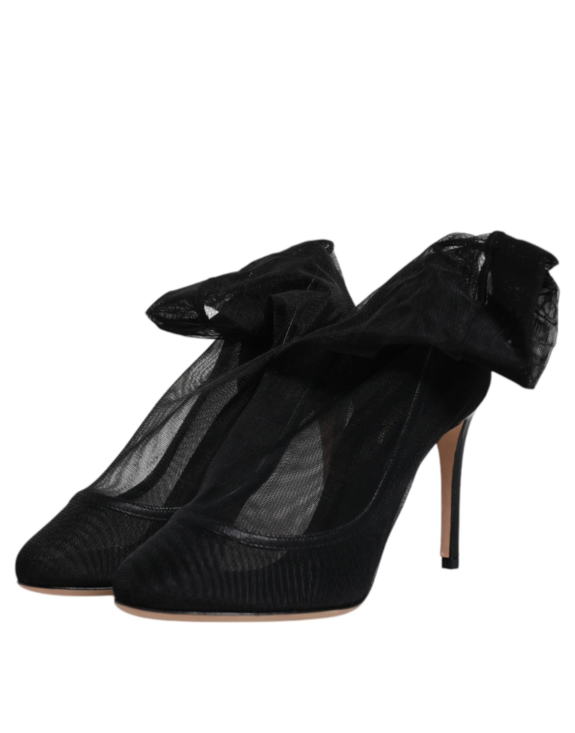 High heel shoes with black straps and a bow on top
