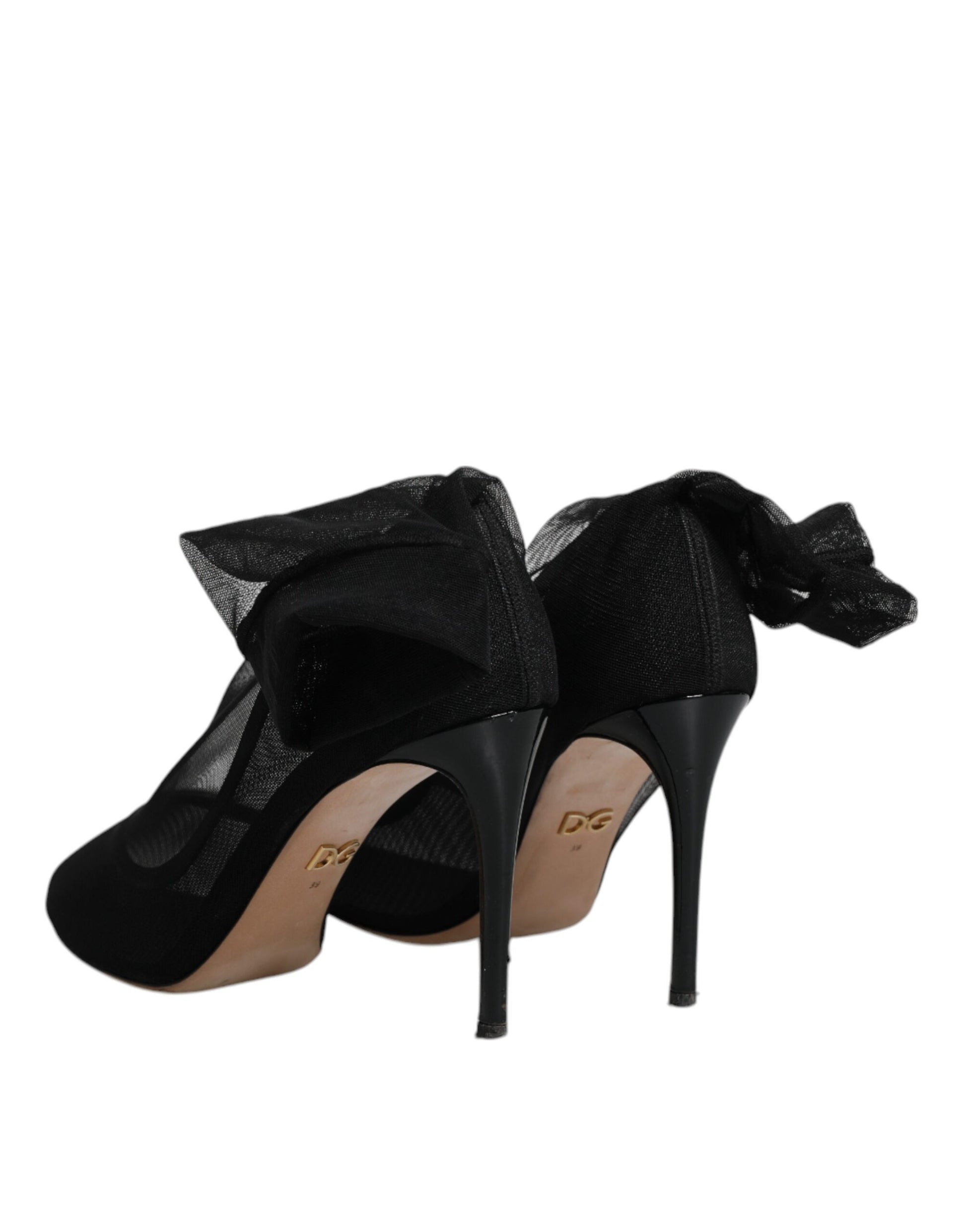 Black high heel shoes with straps and buckles