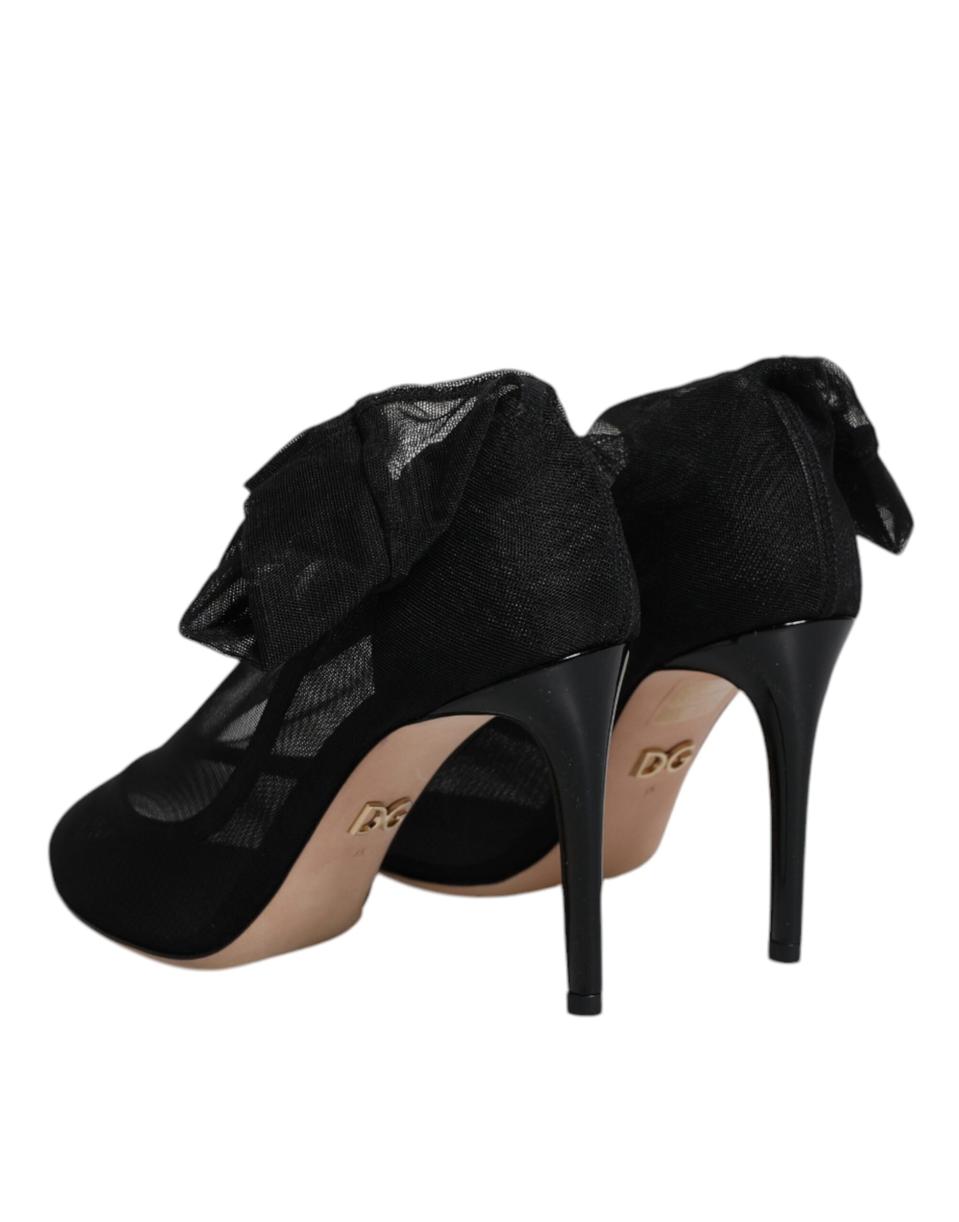 Black high heel shoes with gold accents