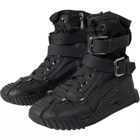 Pair of black boots with laces and straps