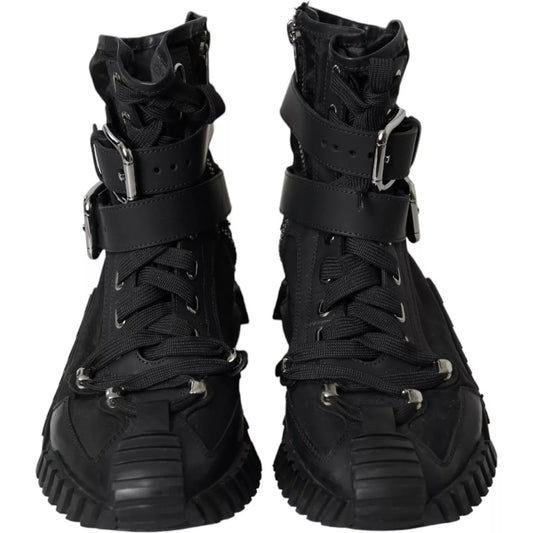 Pair of black boots with laces and straps