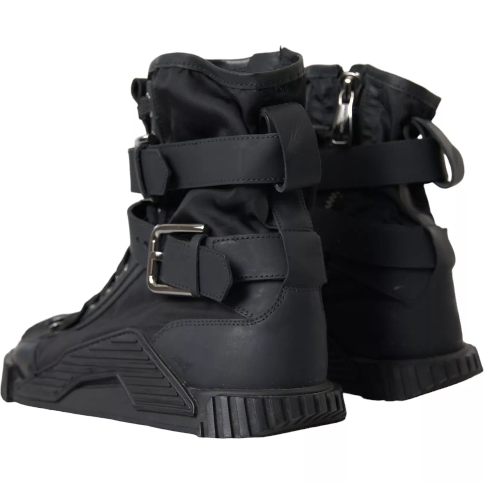 Pair of black boots with straps and buckles