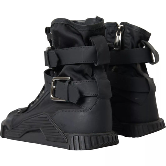 Pair of black boots with straps and buckles