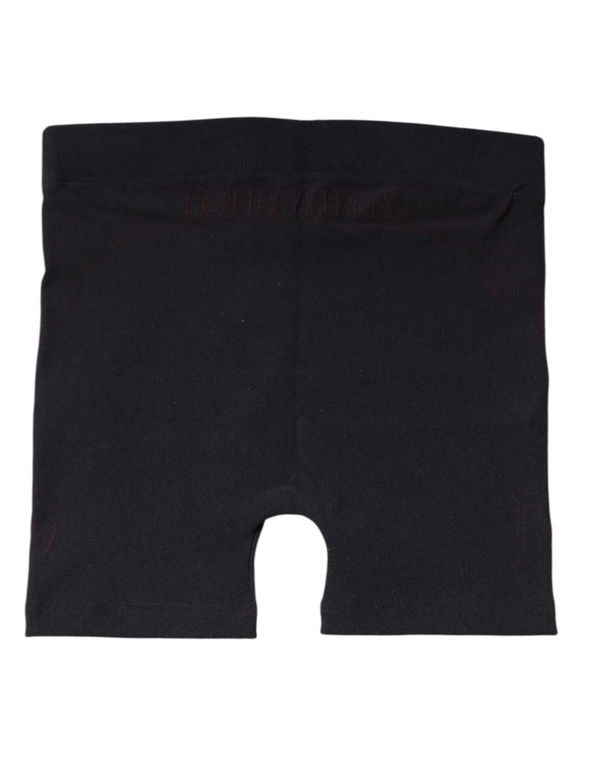 Black athletic shorts with red stripe detailing