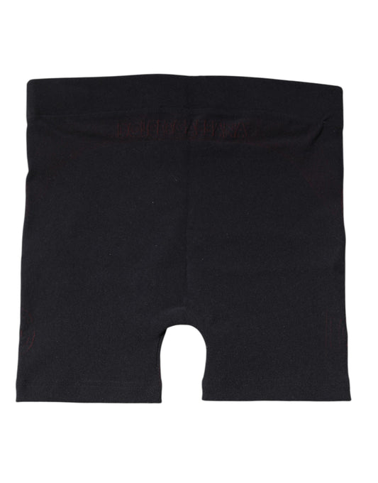 Black athletic shorts with red stripe detailing