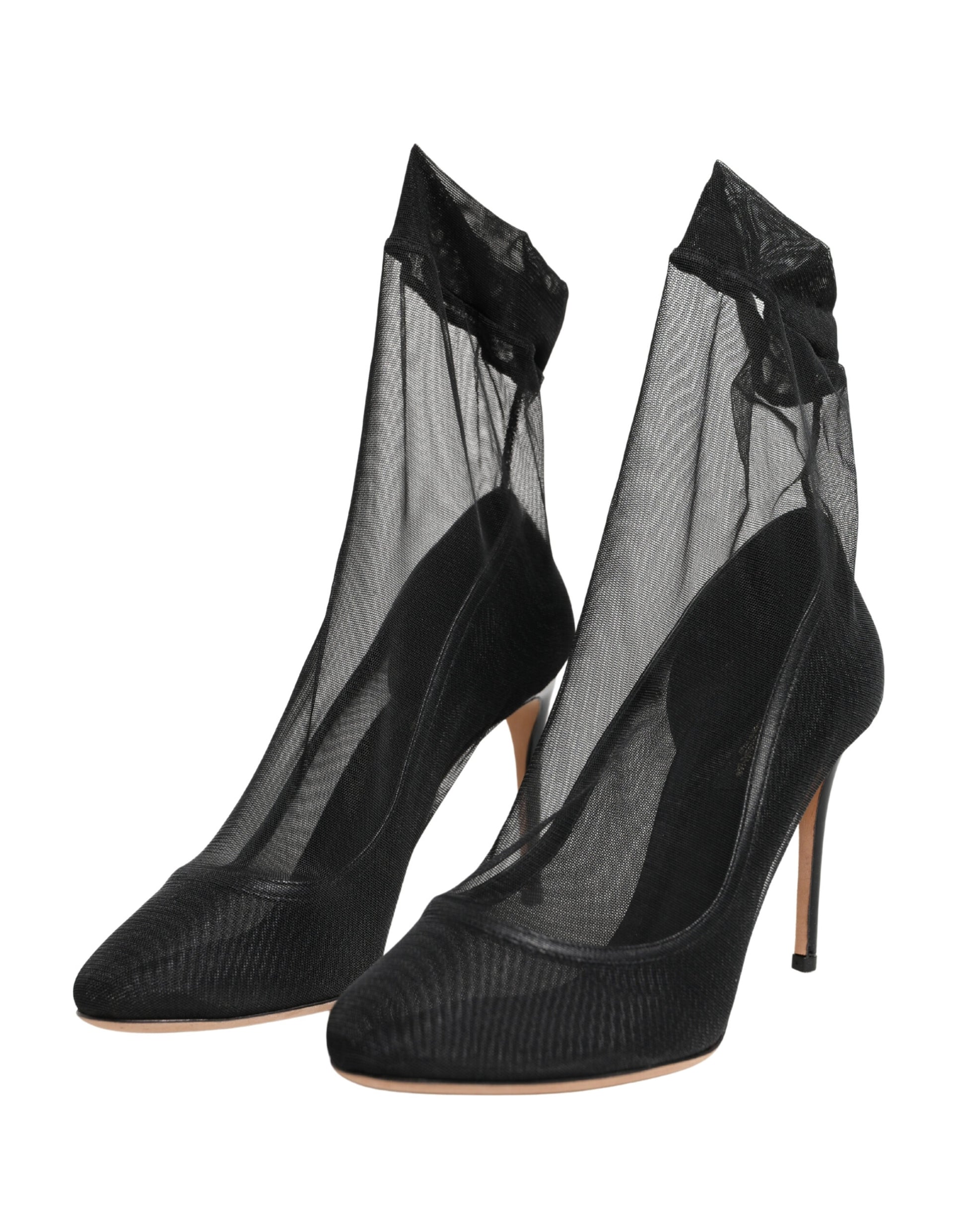 Pair of black high heel boots with lace detailing