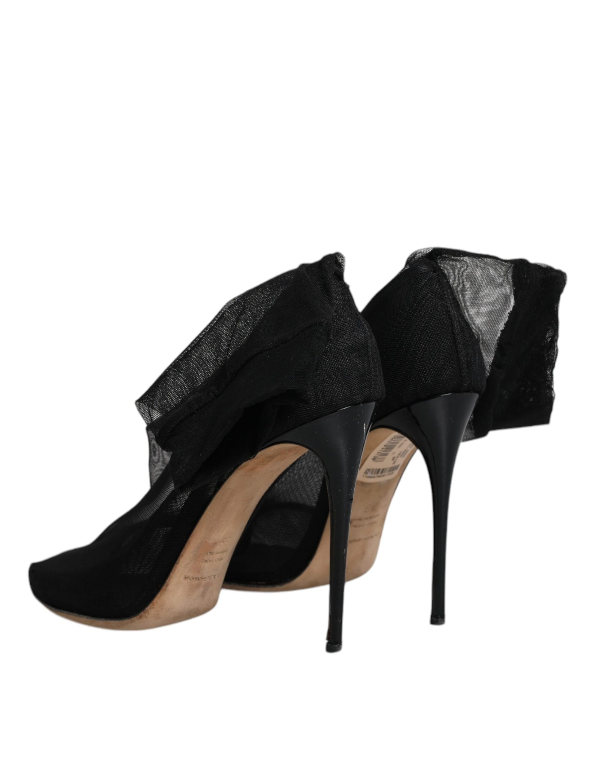 Black high heel shoes with straps and a bow on top
