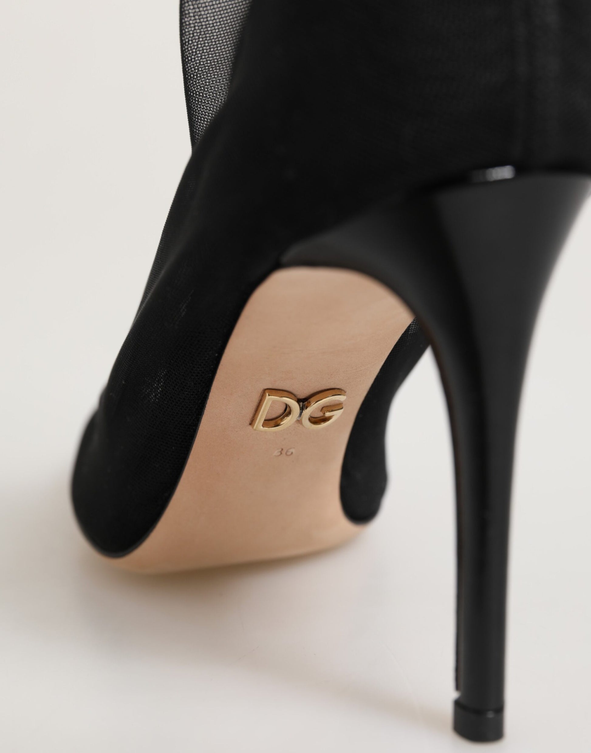 Black high heel shoe with tan toe