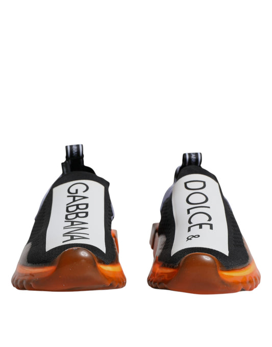 Pair of sneakers with orange and black accents