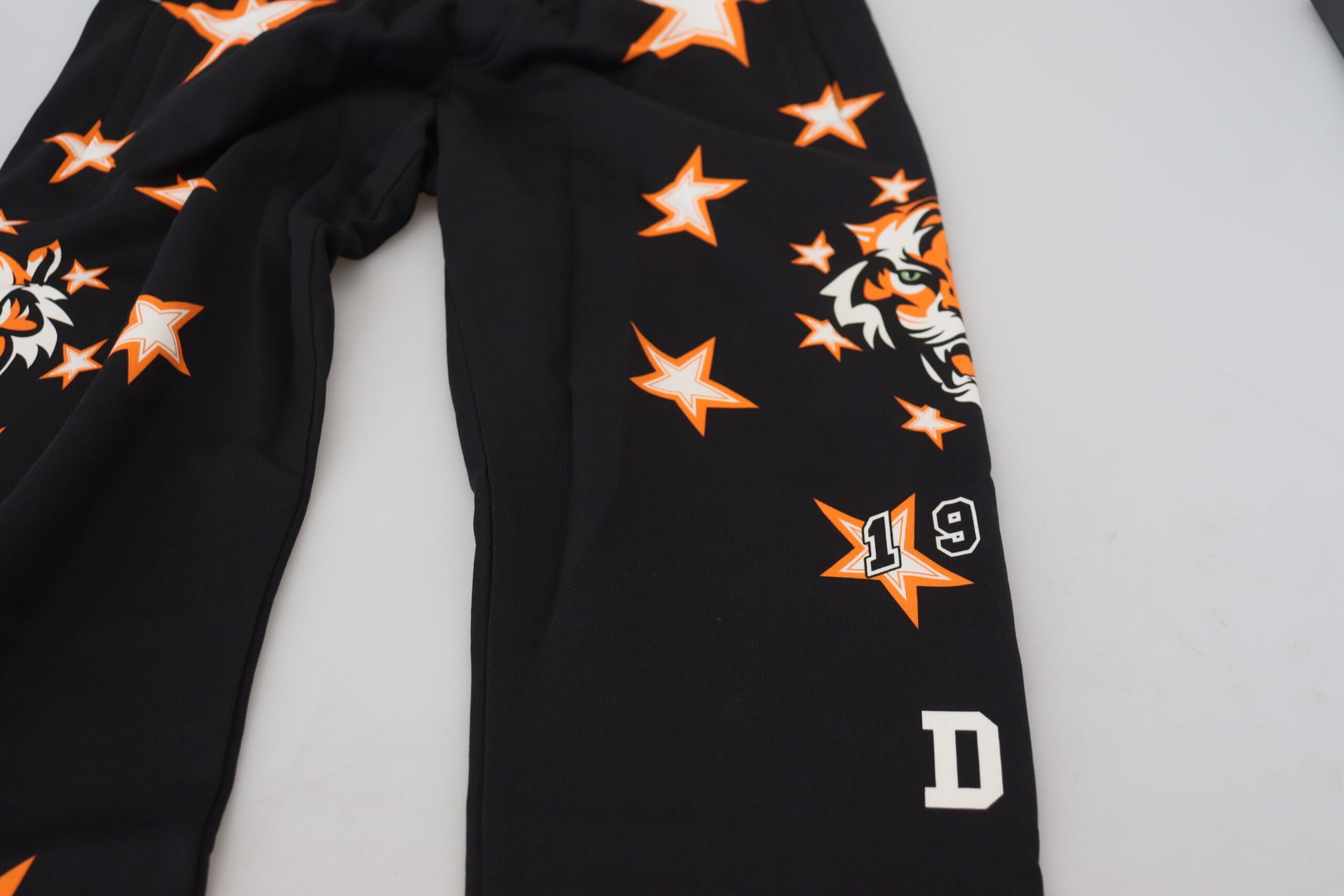 Black pants with stars and number 19 on them