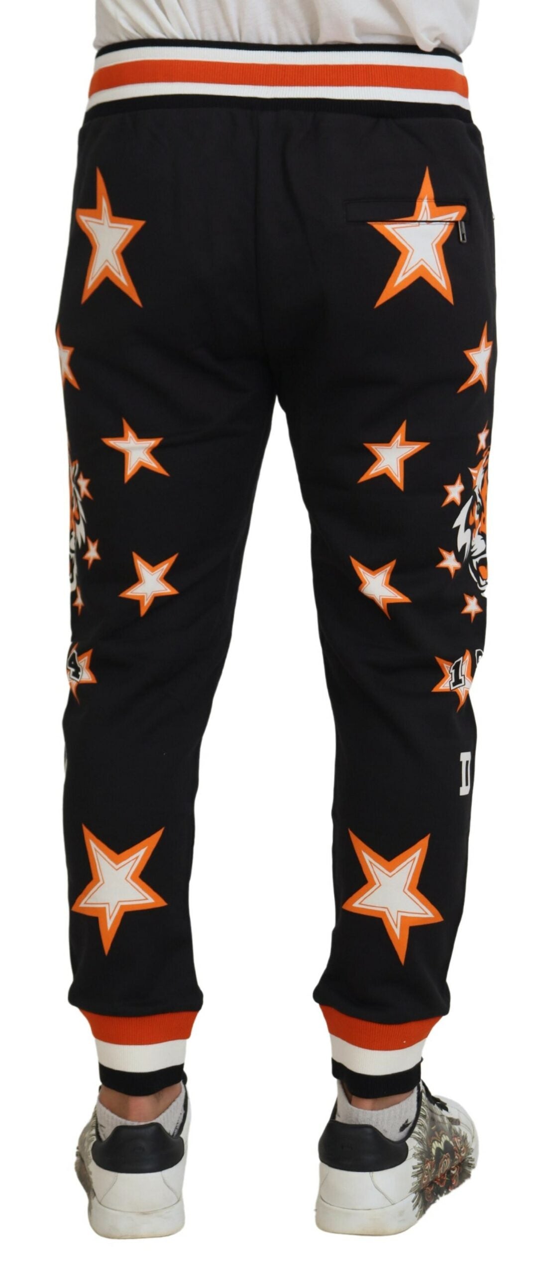 Black pants with orange stars