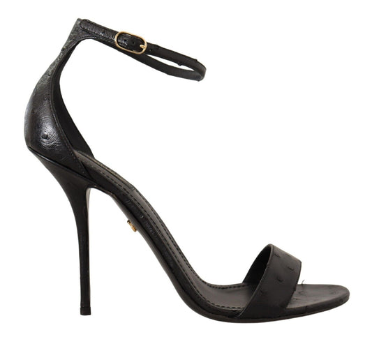 Black high heel sandal with ankle strap and gold buckle