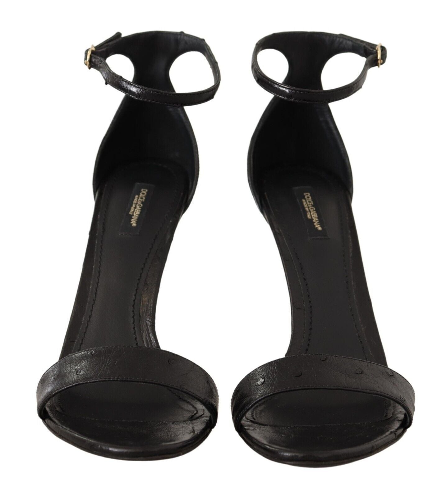 Pair of black high heel shoes with ankle straps and a bow on top