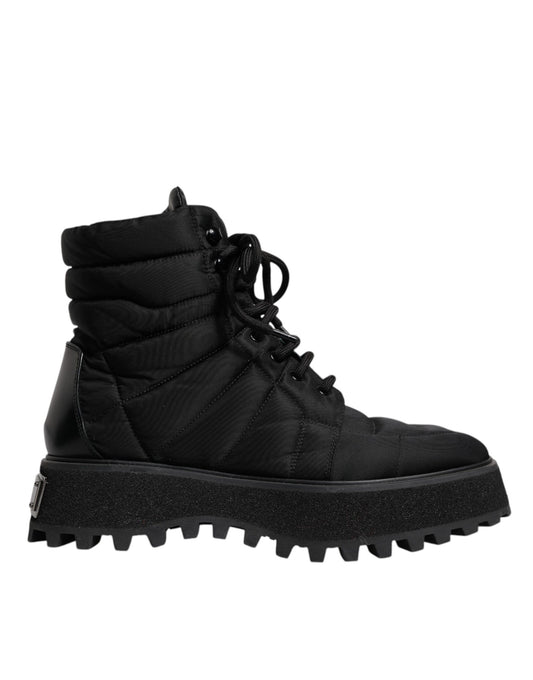 Black rubber boot with a glittery texture on the sole