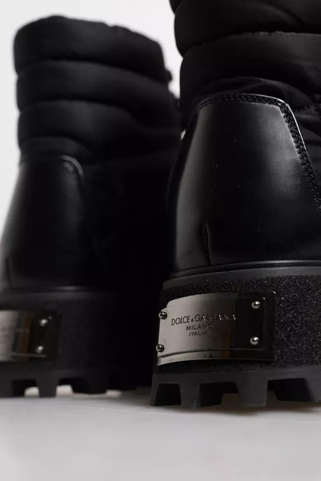 Pair of black boots with visible brand name on side