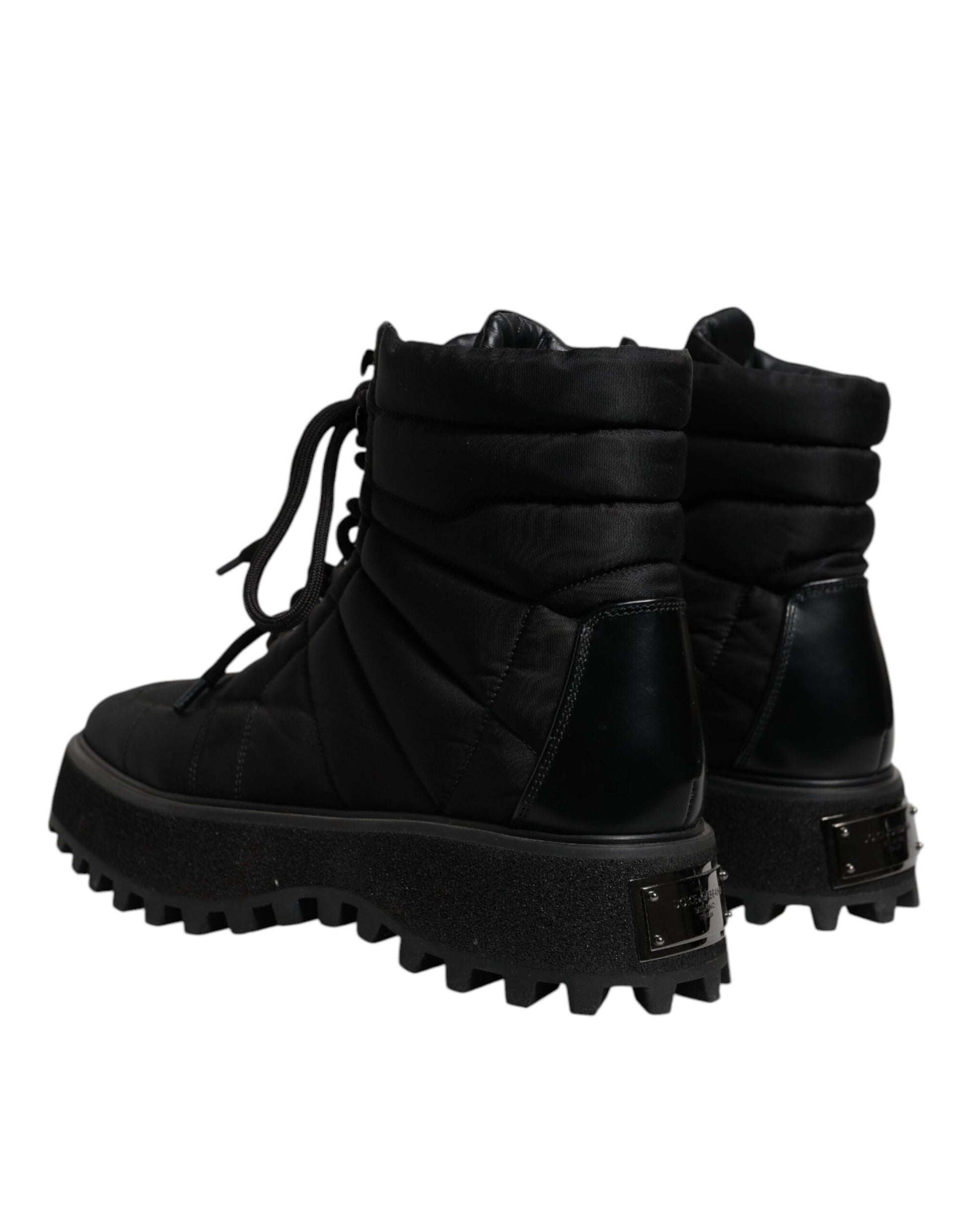 Pair of black boots with laces and buckles