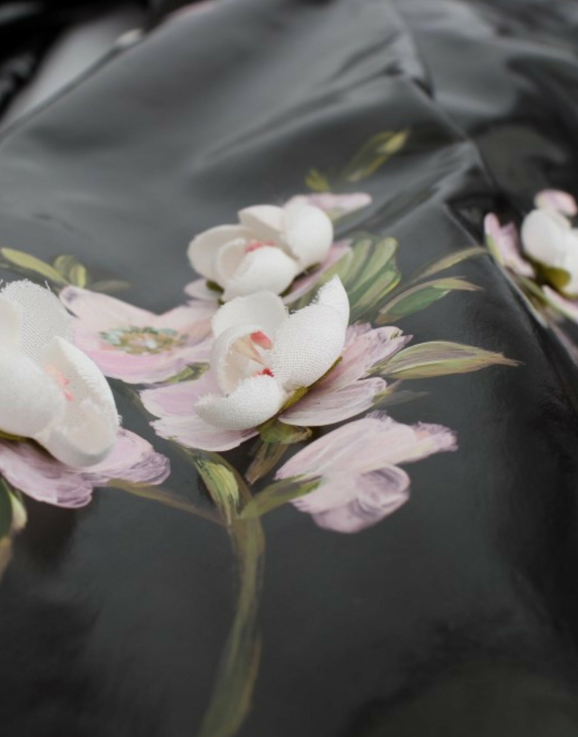 Black leather jacket with floral embroidery on front