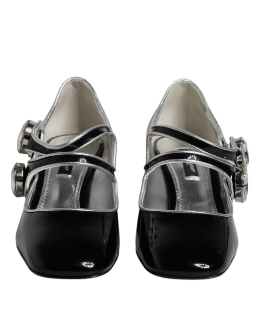 Pair of black women's shoes with silver buckles