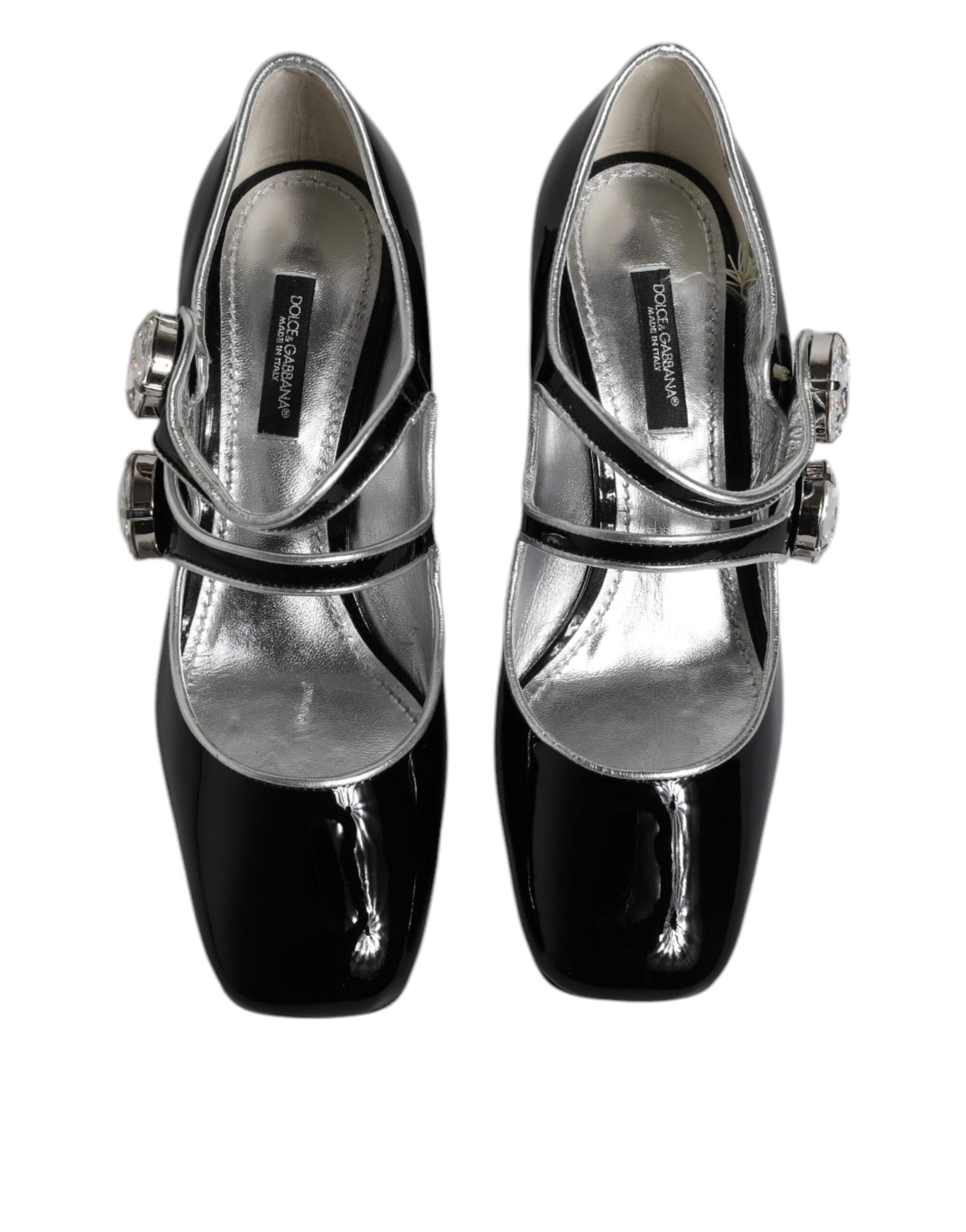 Pair of black glittery women's shoes with silver buckles