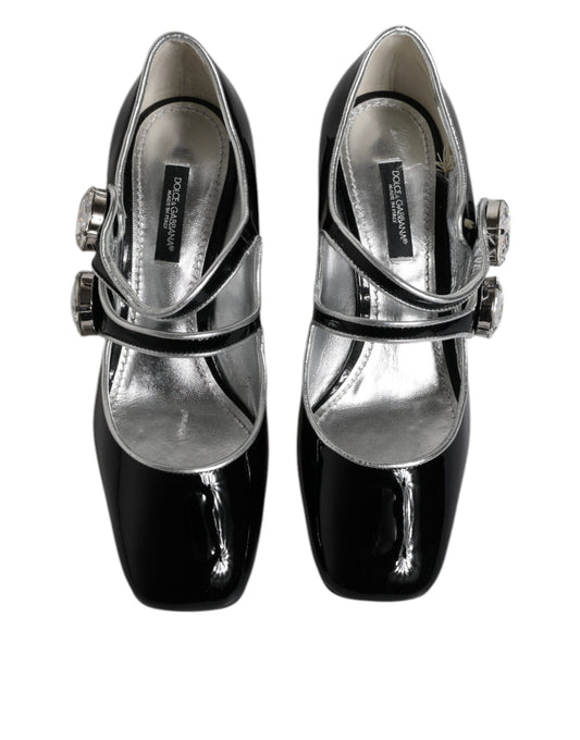 Pair of black glittery women's shoes with silver buckles