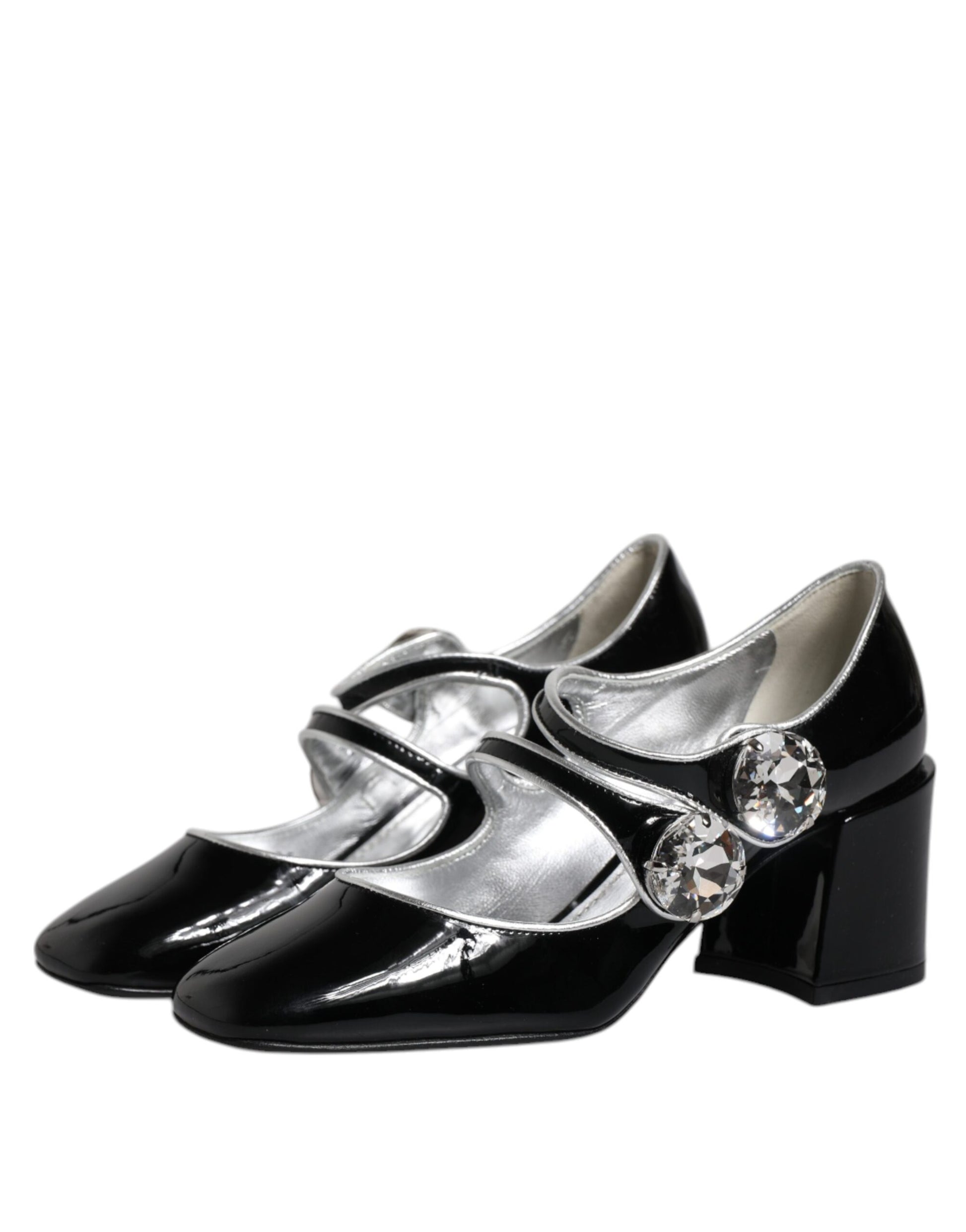 Pair of black shoes with silver accents and rhinestones