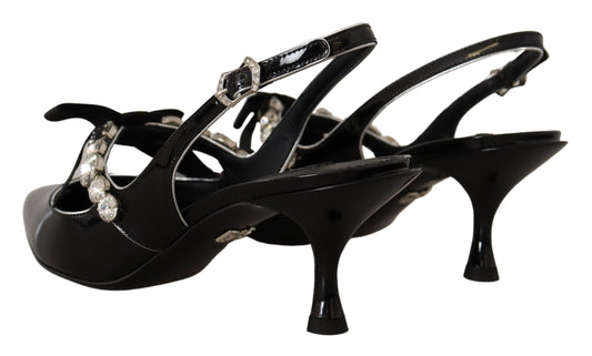 Pair of black high heel shoes with rhinestones and a strap across the foot