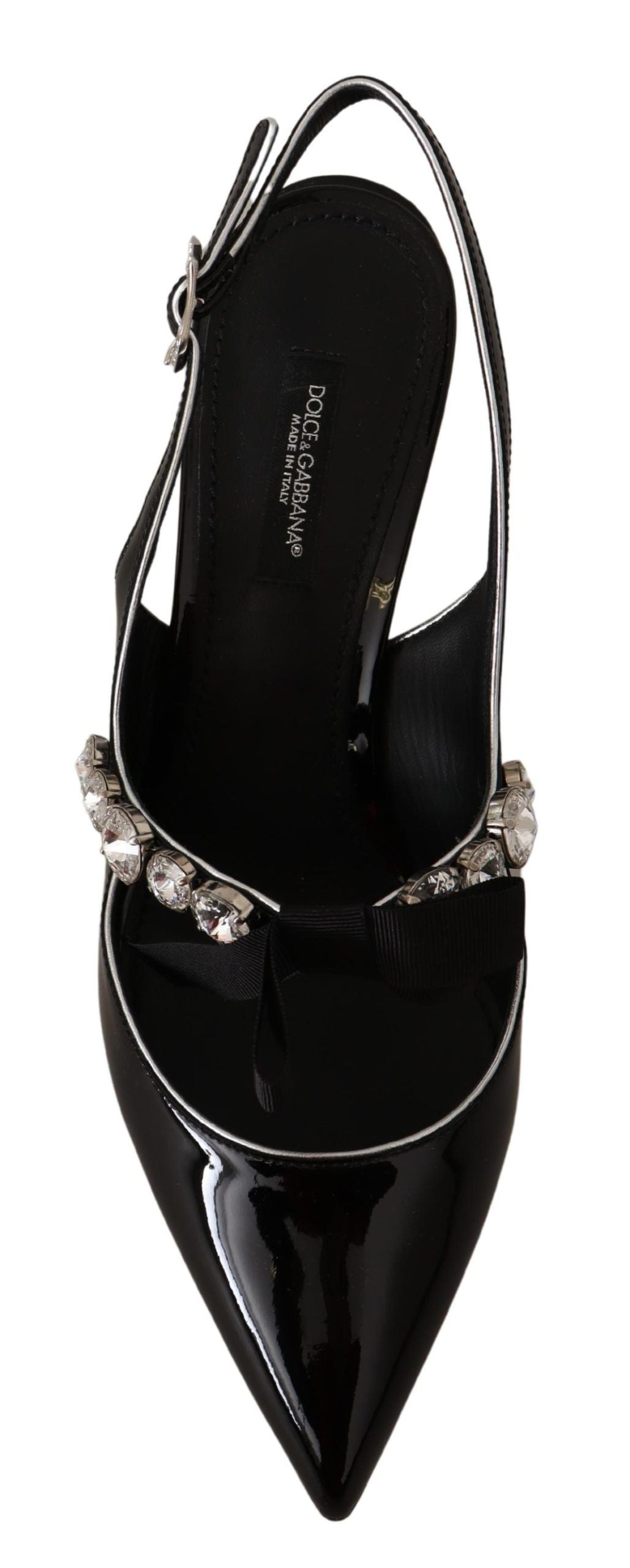 Black high heel shoe with embellishments on top of foot and ankle strap
