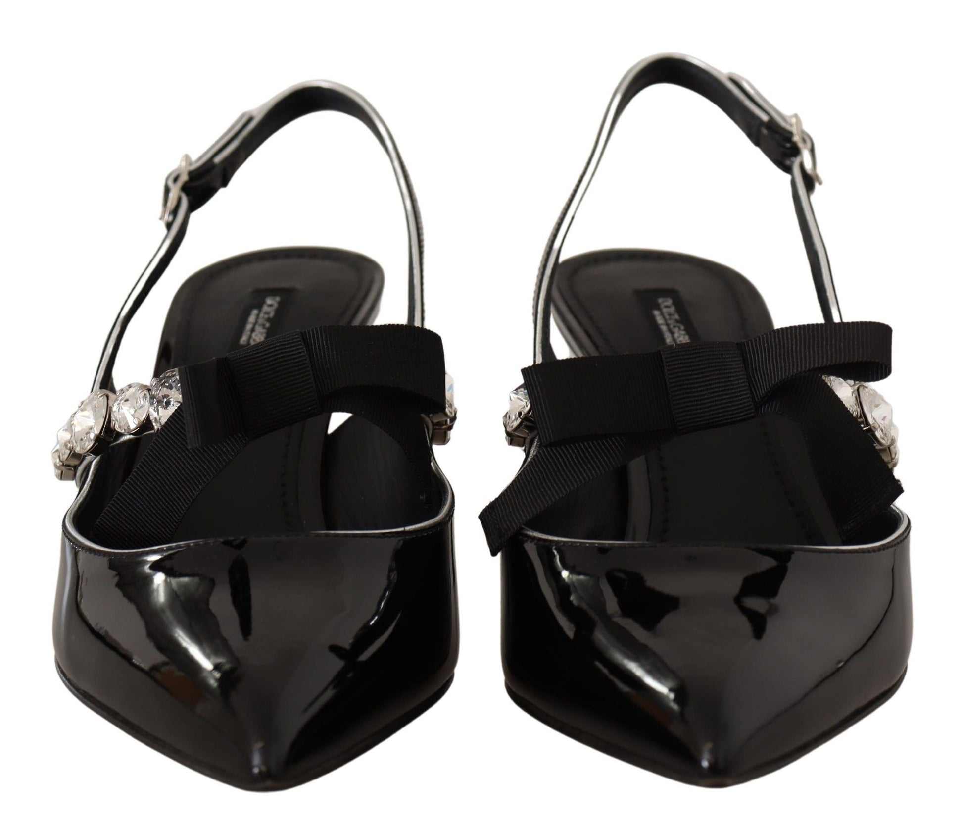 Pair of black high heel shoes with rhinestones and a strap across the foot